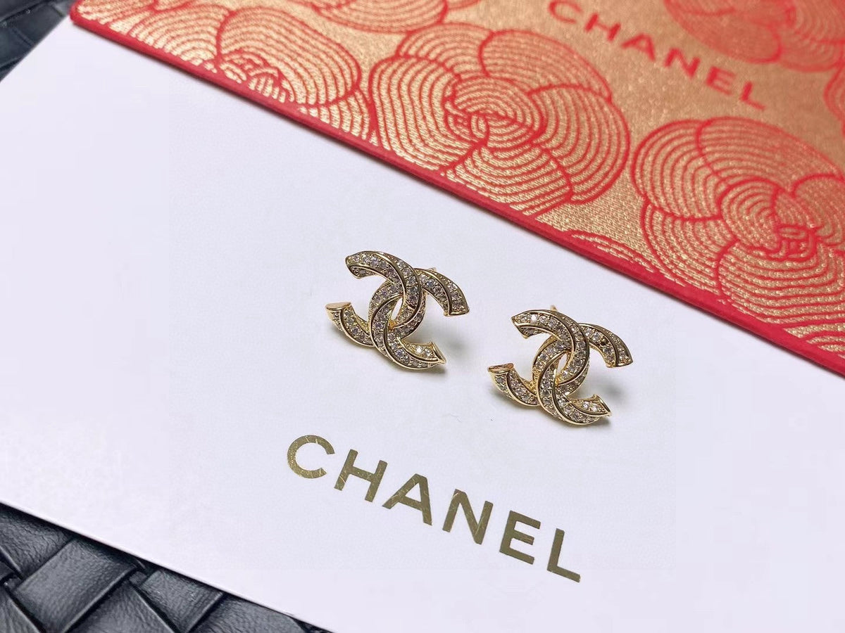 Martin Graham stud earrings in polished metal-tone – styled product view