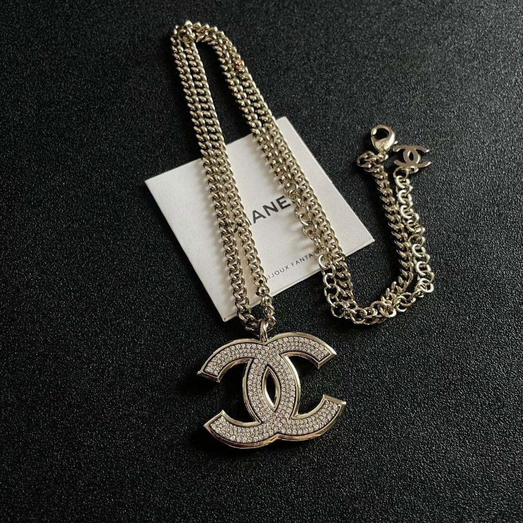 Martin Graham pendant necklace in polished metal-tone – close-up detail