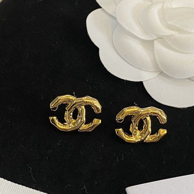 Martin Graham stud earrings in polished metal-tone – detail view