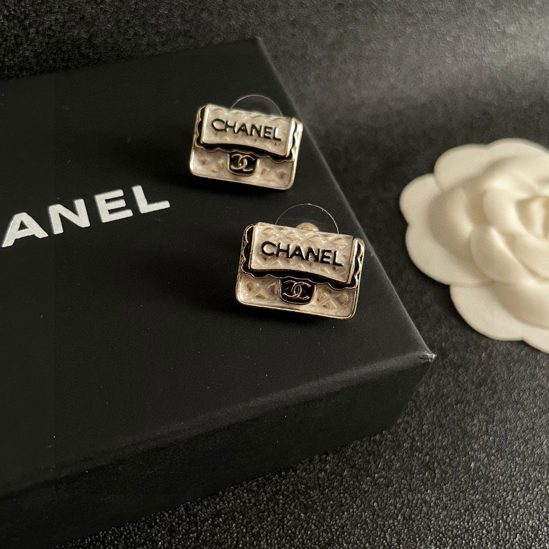 Martin Graham stud earrings in polished metal-tone – detail view
