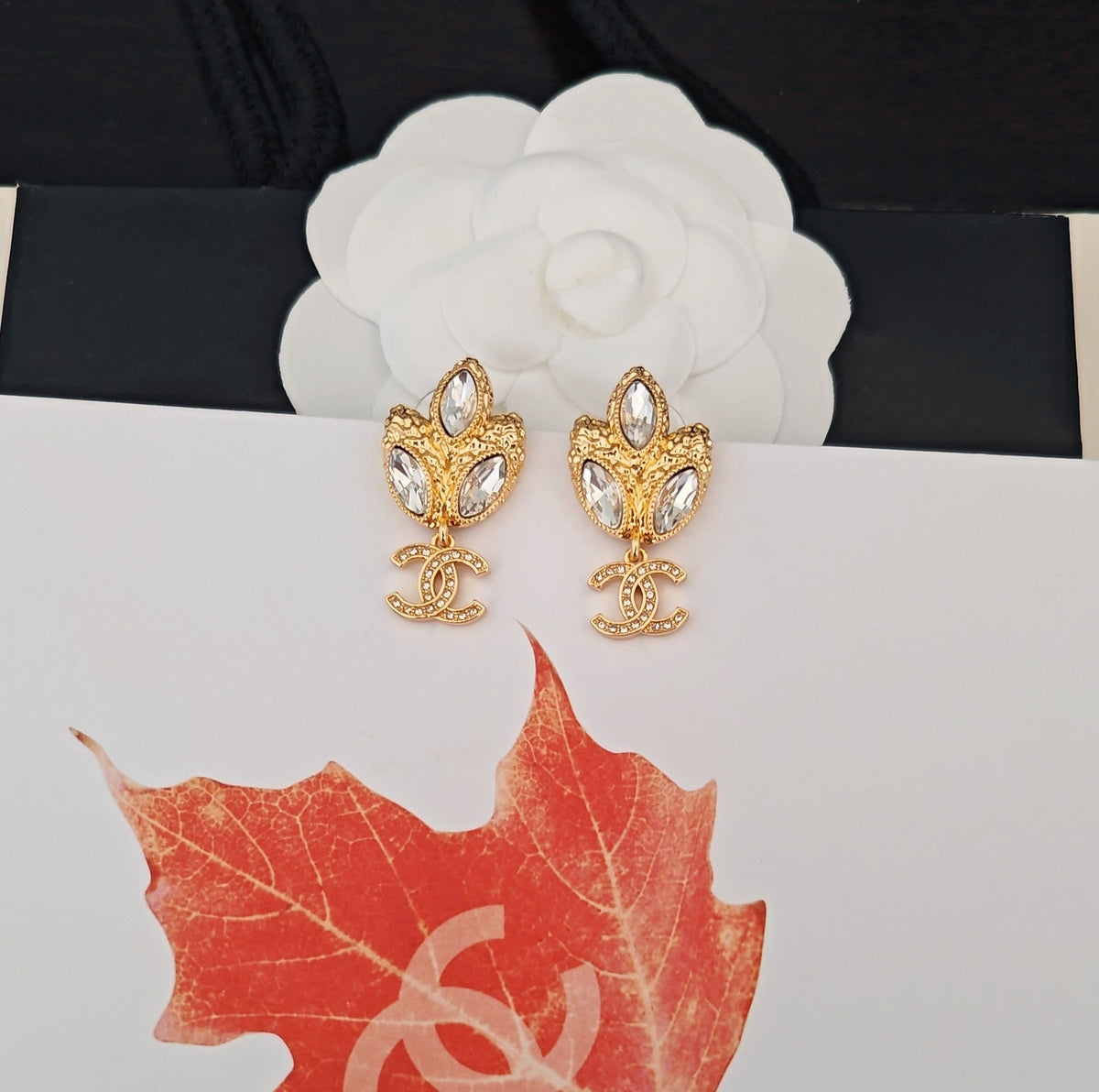 Martin Graham earrings in polished metal-tone – close-up detail