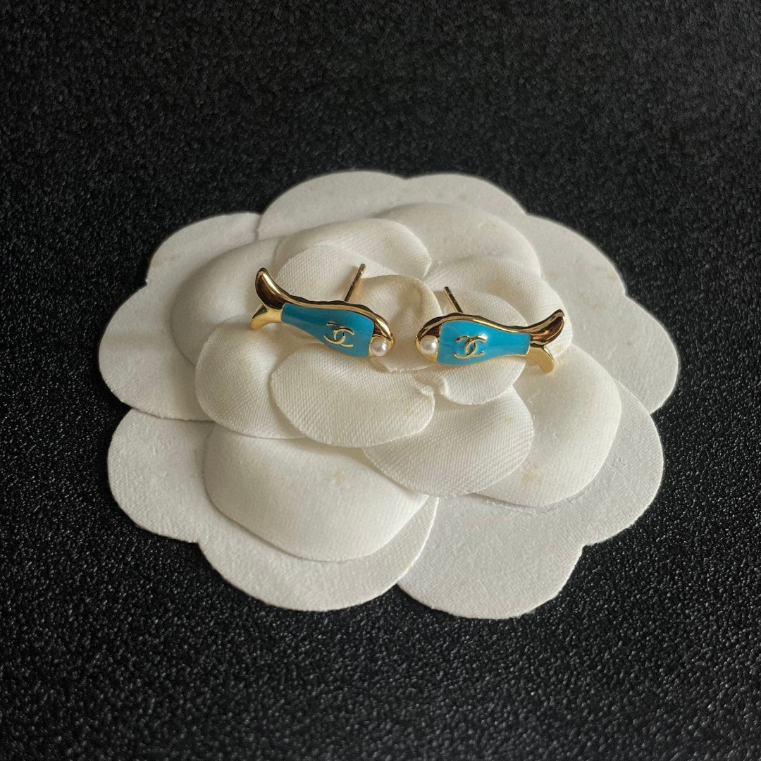 Martin Graham stud earrings in polished metal-tone – detail view