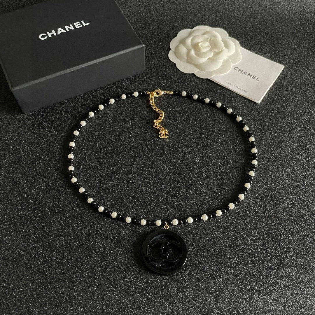 Martin Graham pendant necklace in polished metal-tone – detail view