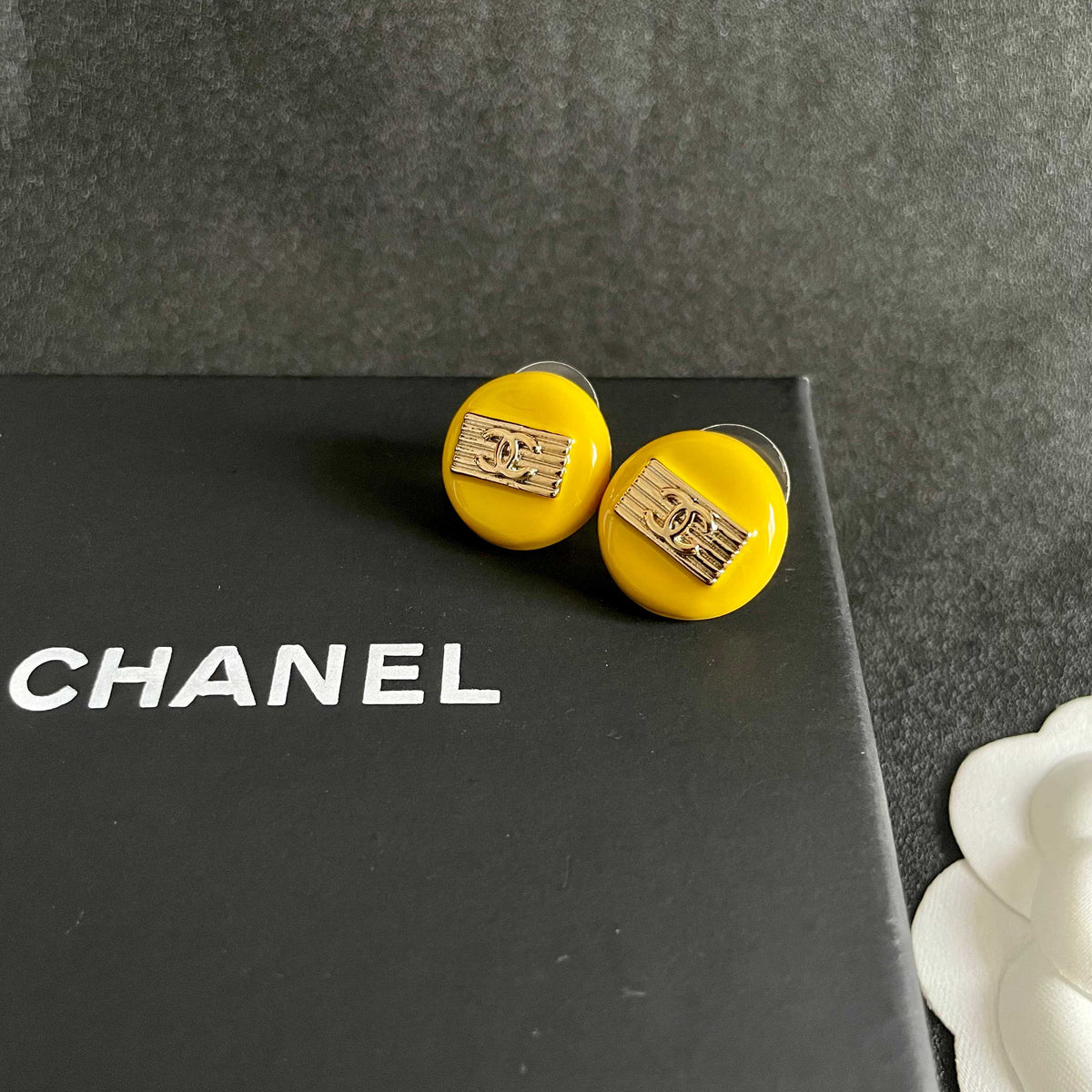 Martin Graham stud earrings in polished metal-tone – detail view
