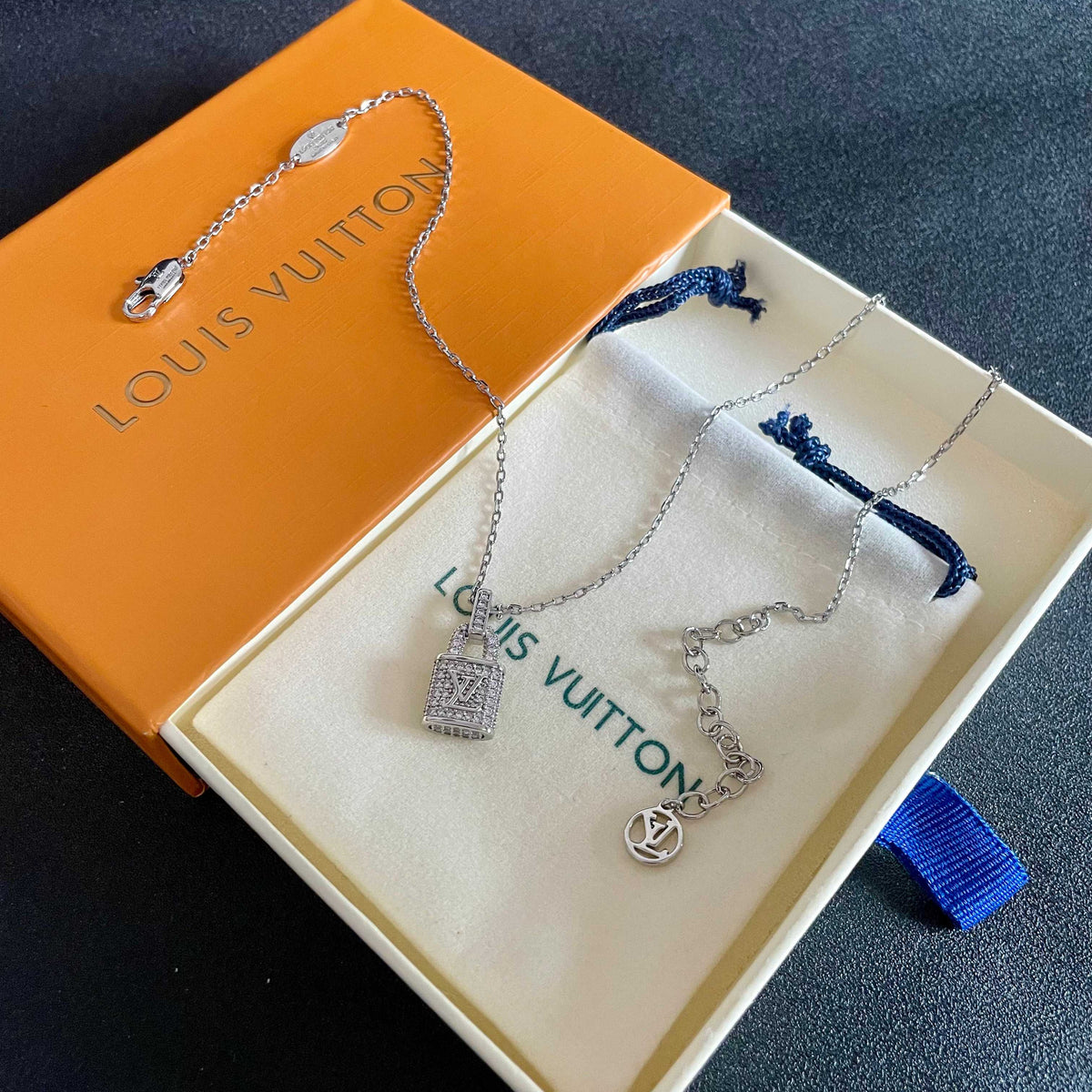 Martin Graham pendant necklace in polished metal-tone – detail view