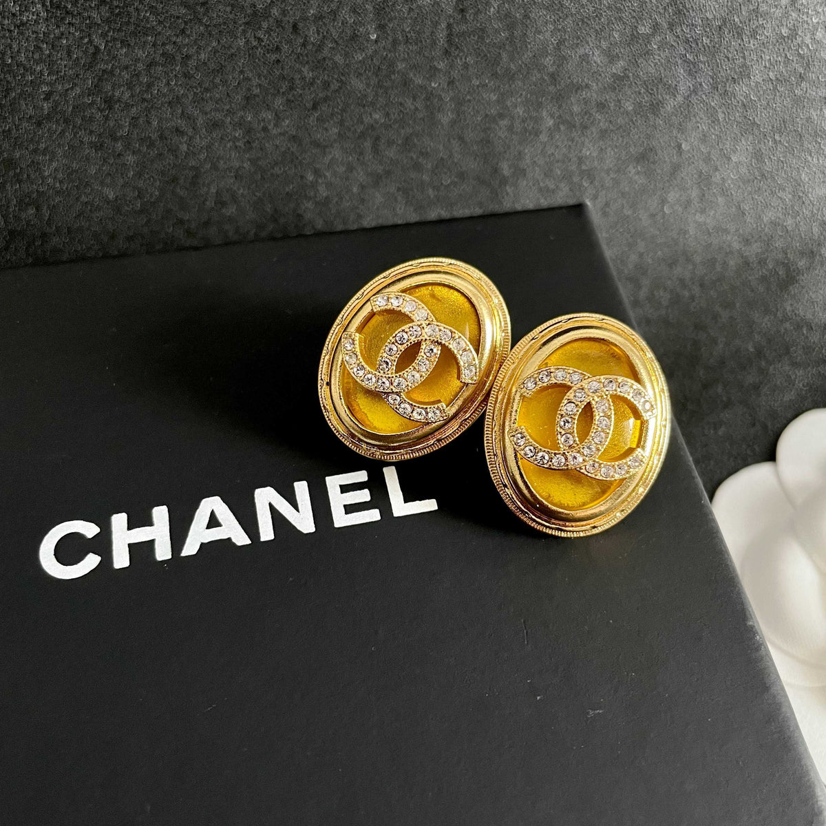 Martin Graham stud earrings in polished metal-tone – detail view
