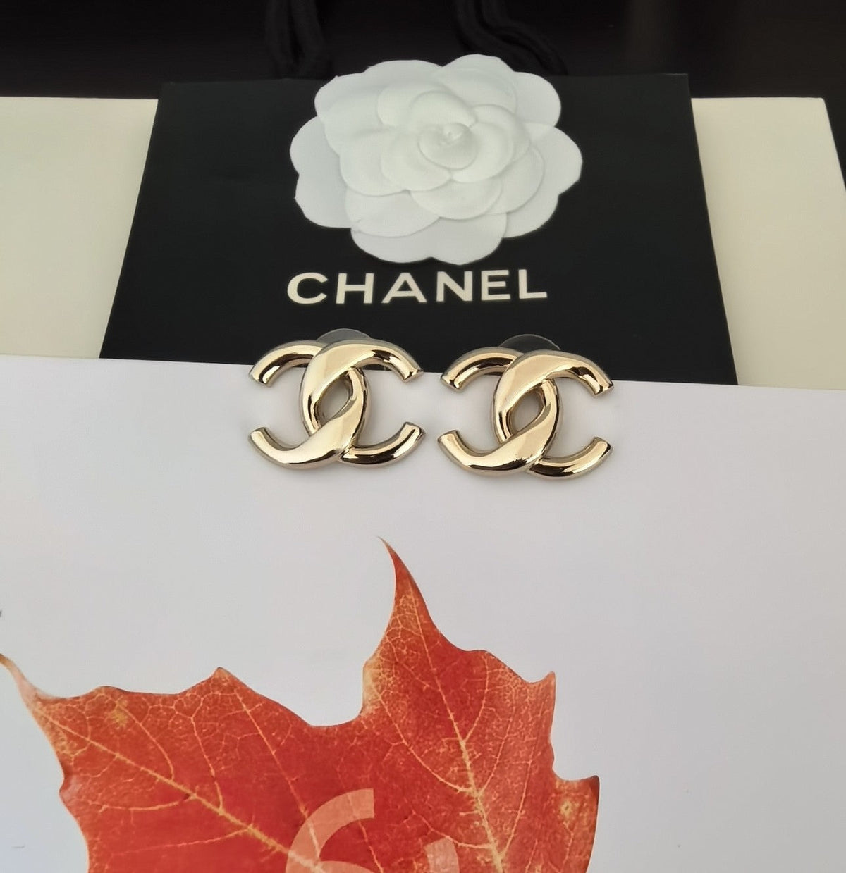 Martin Graham stud earrings in polished metal-tone – styled product view
