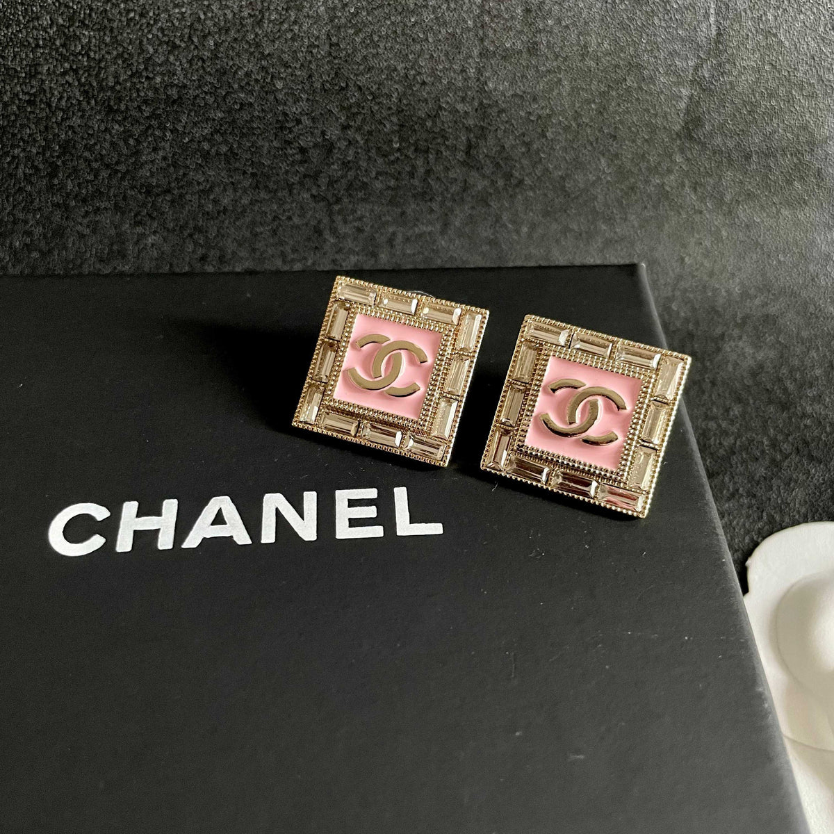 Martin Graham stud earrings in polished metal-tone – detail view