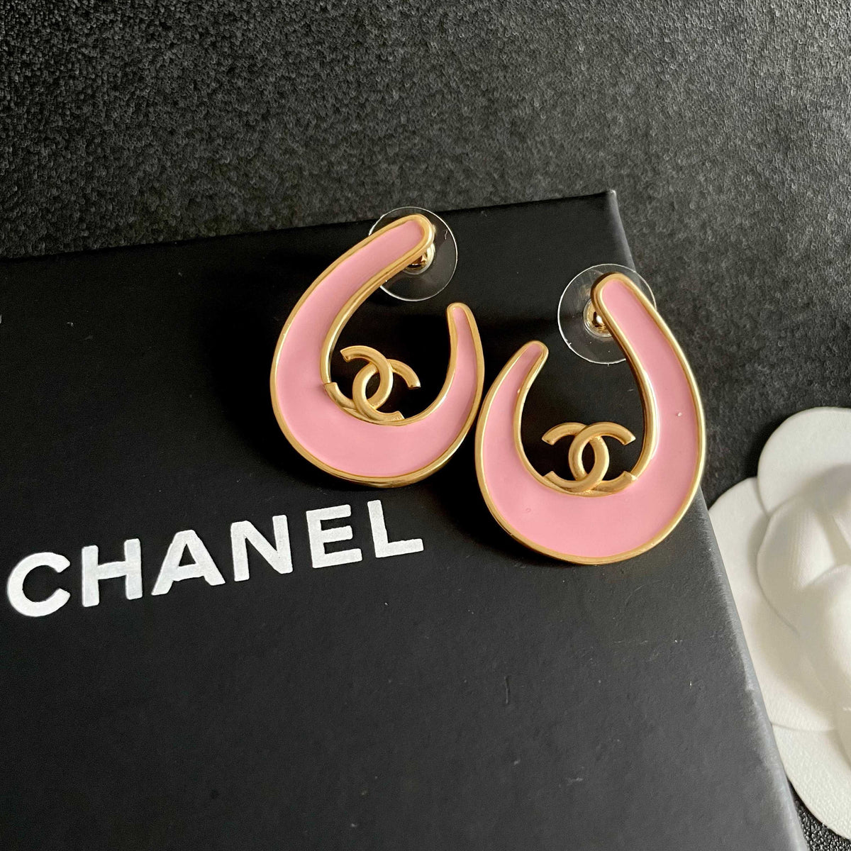 Martin Graham stud earrings in polished metal-tone – detail view