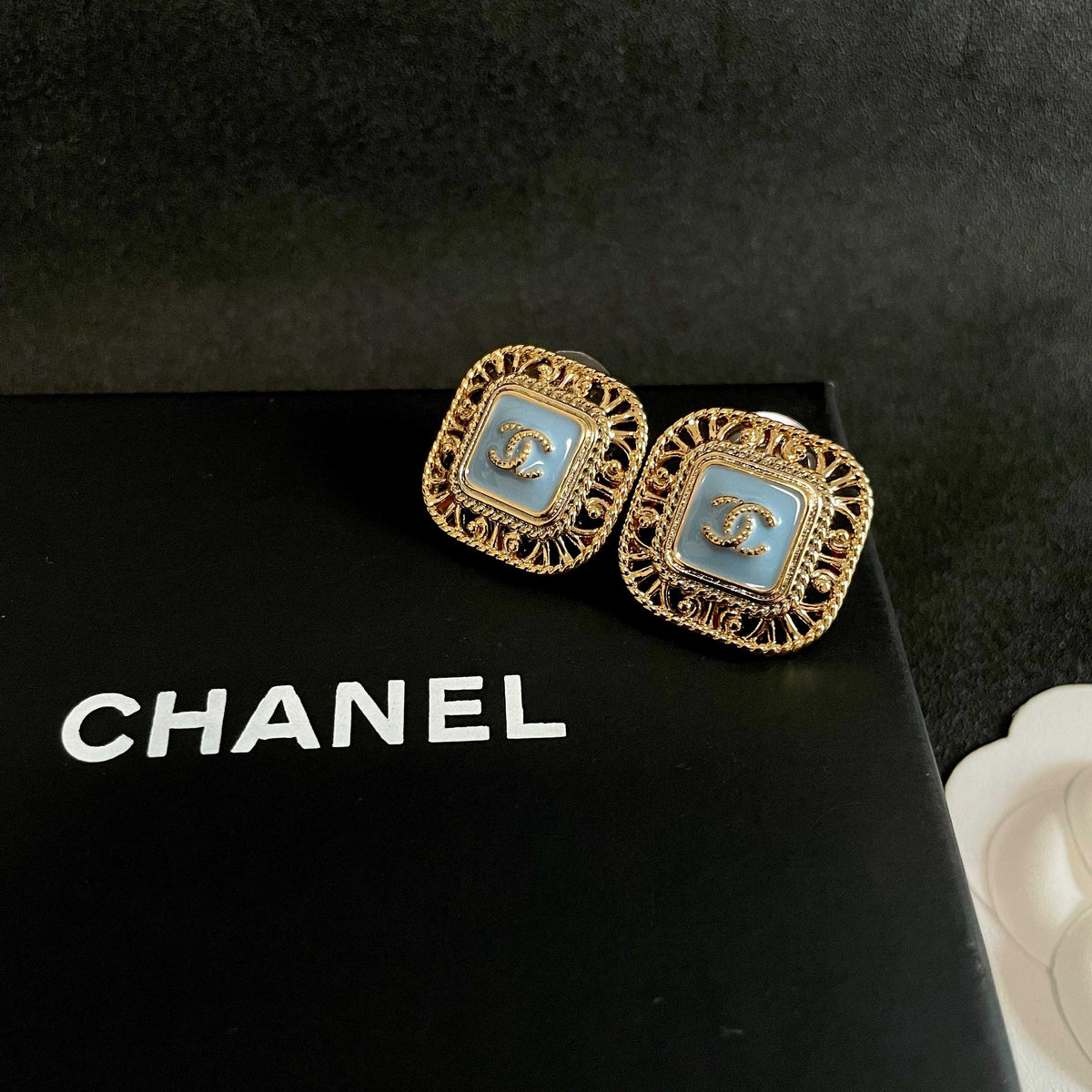 Martin Graham stud earrings in polished metal-tone – detail view