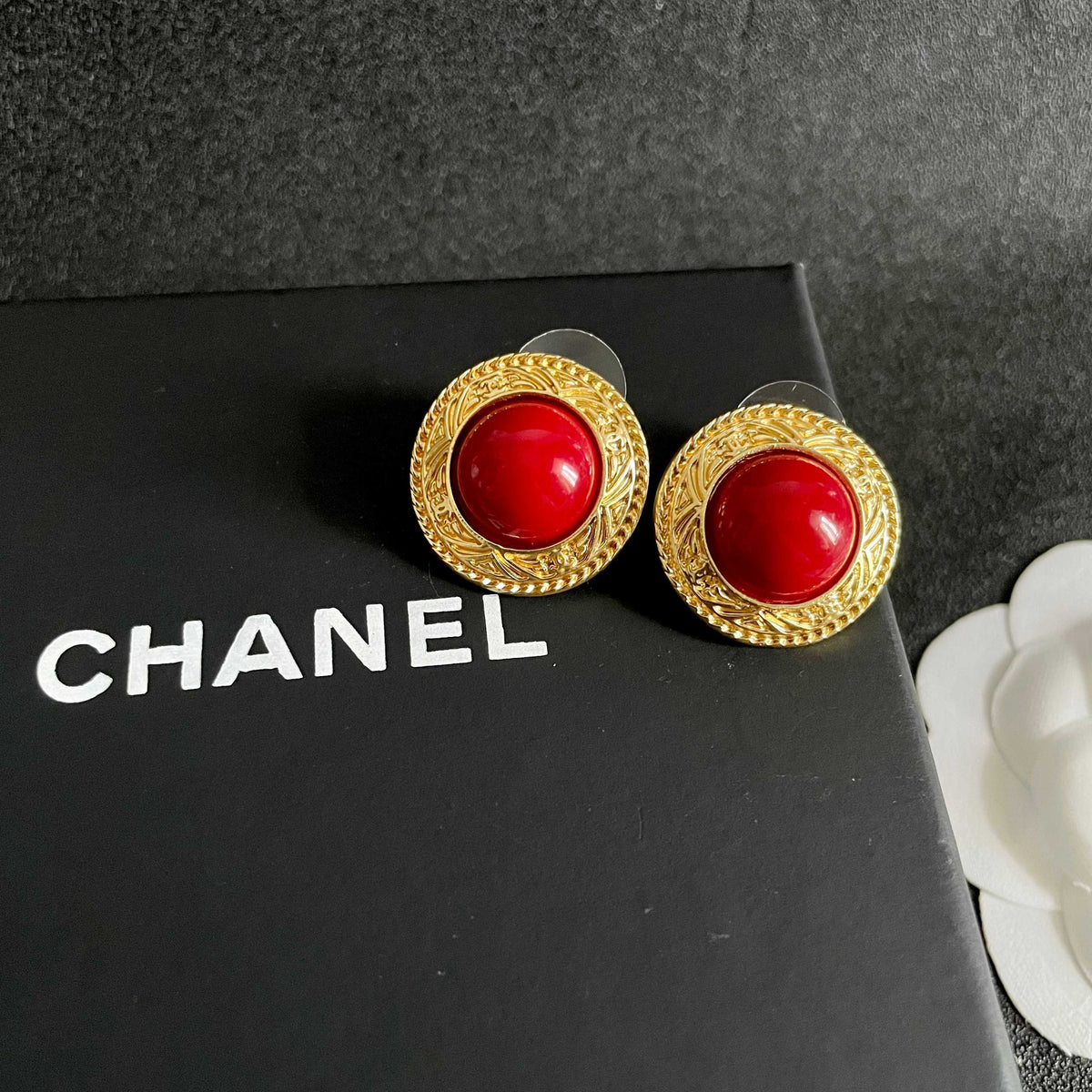 Martin Graham stud earrings in polished metal-tone – detail view