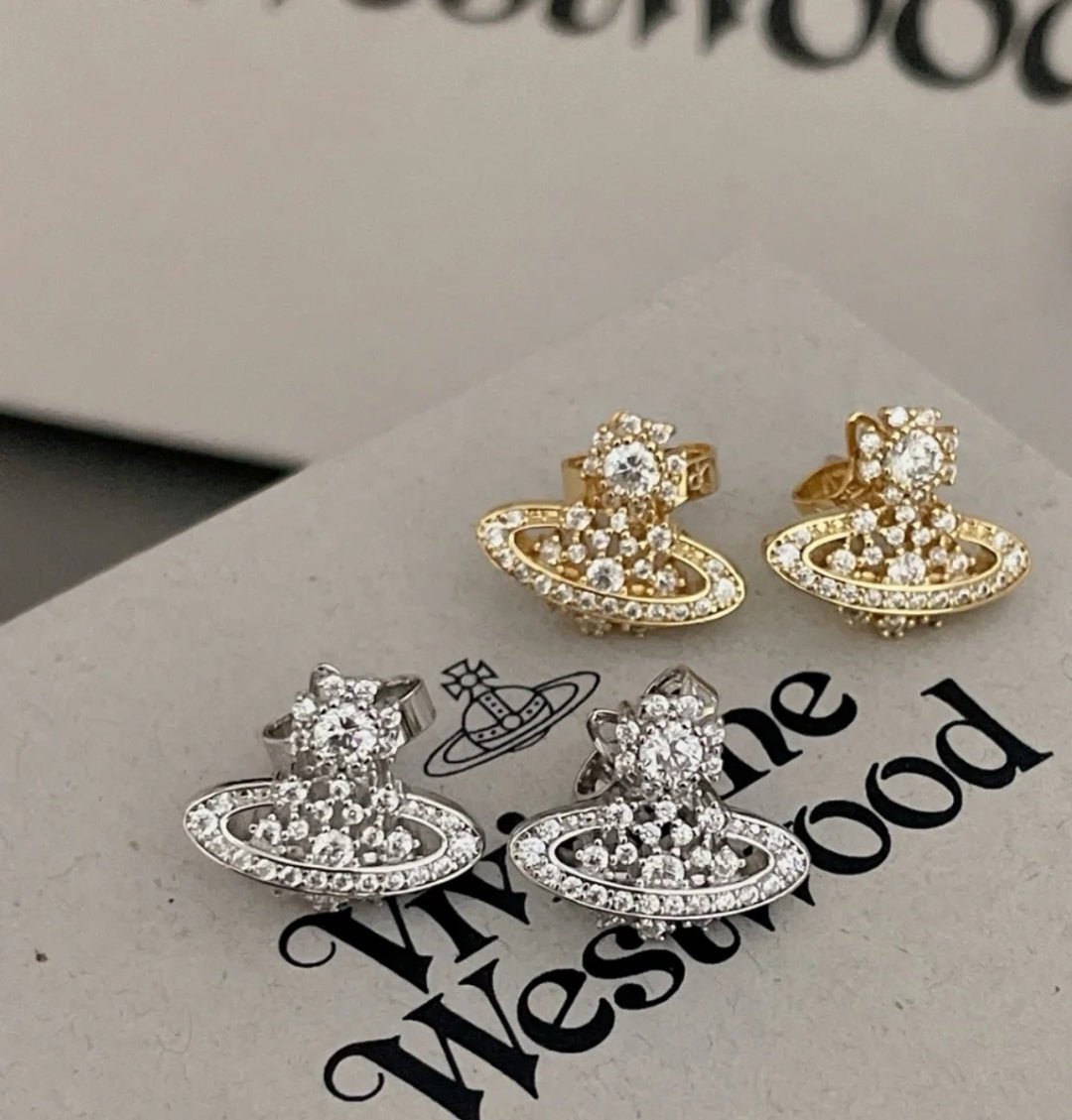 Martin Graham stud earrings in polished metal-tone – styled product view