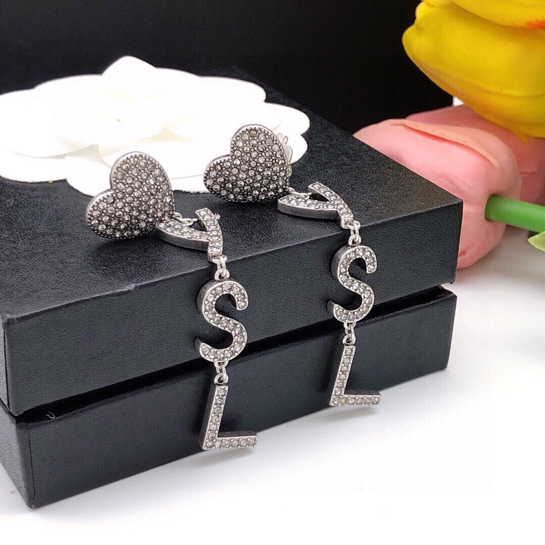 Martin Graham stud earrings in polished metal-tone – detail view