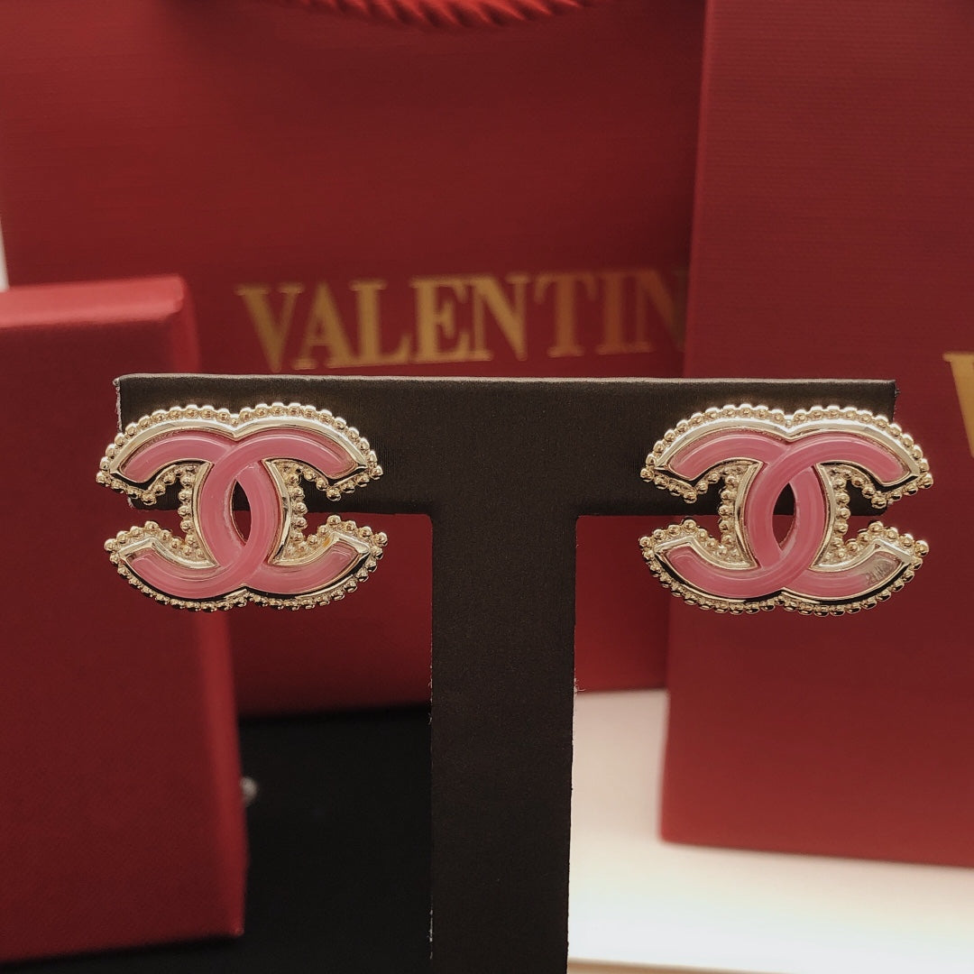 Martin Graham stud earrings in polished metal-tone – detail view