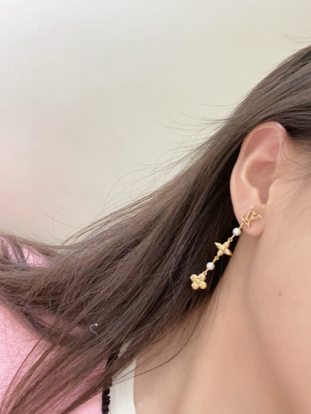 Martin Graham stud earrings in polished metal-tone – close-up detail