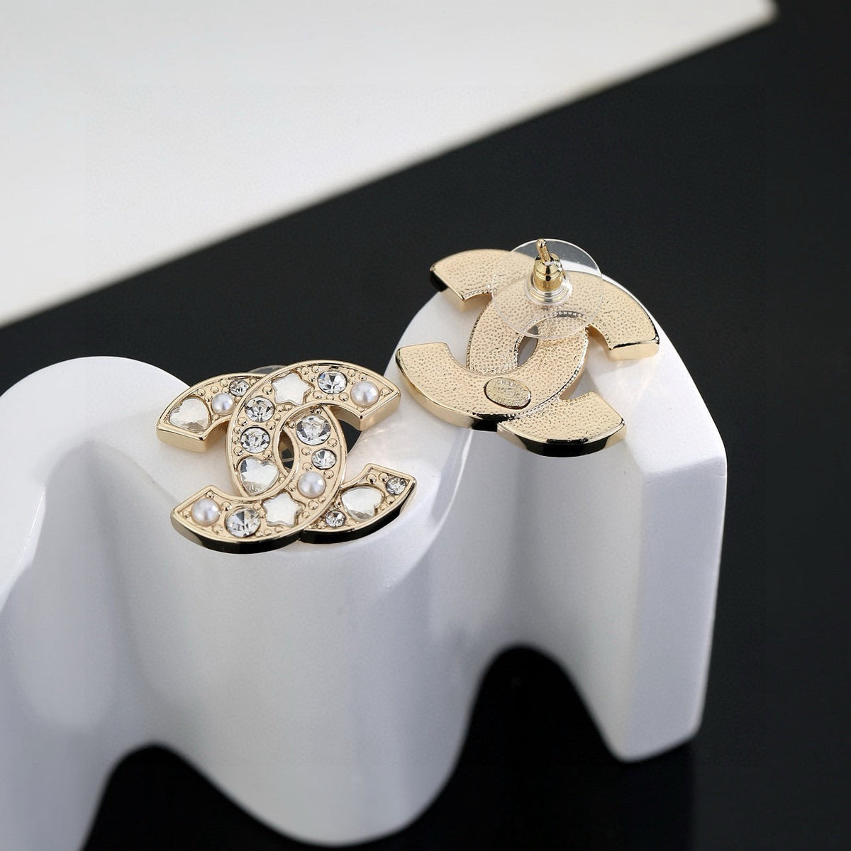 Martin Graham stud earrings in polished metal-tone – styled product view