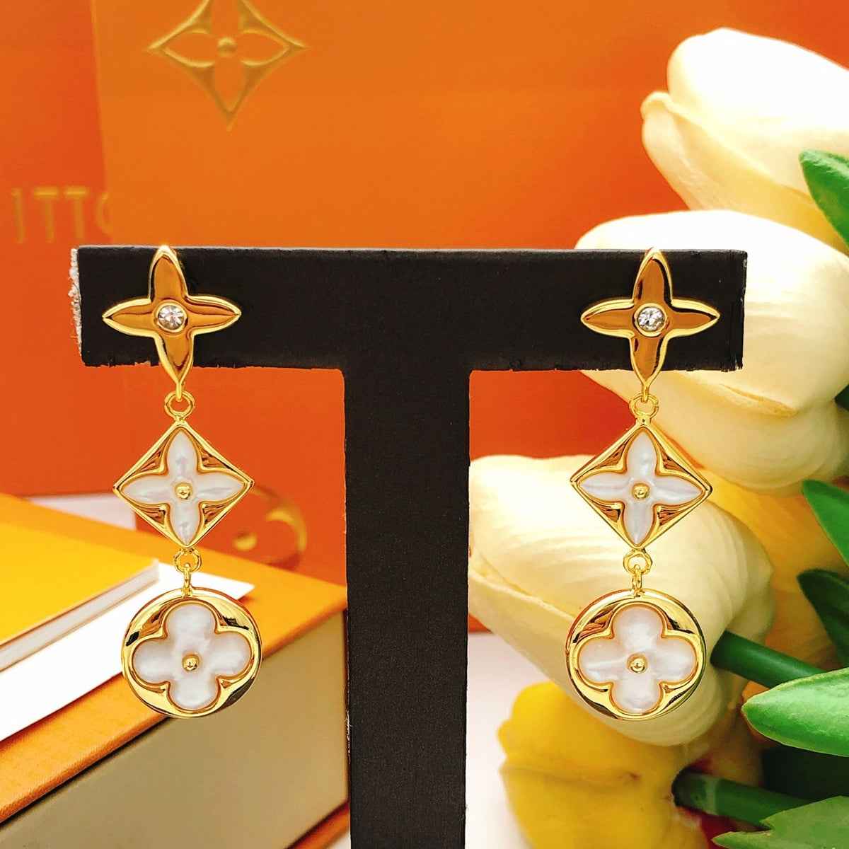 Martin Graham stud earrings in polished metal-tone – styled product view