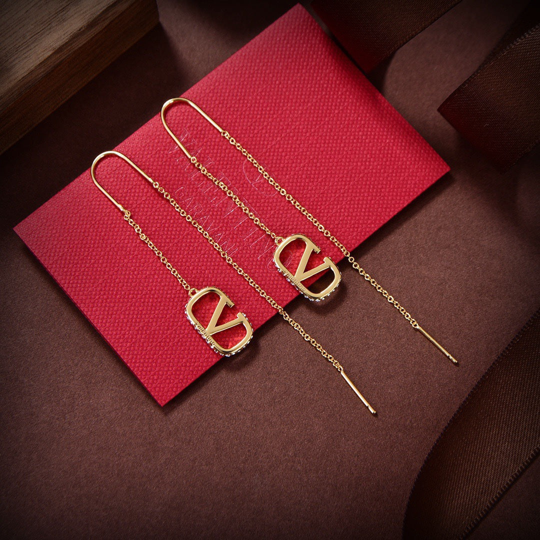 Martin Graham stud earrings in polished metal-tone
