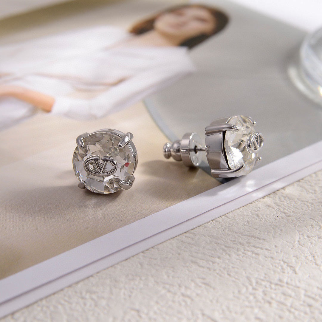 Martin Graham stud earrings in polished metal-tone – front view