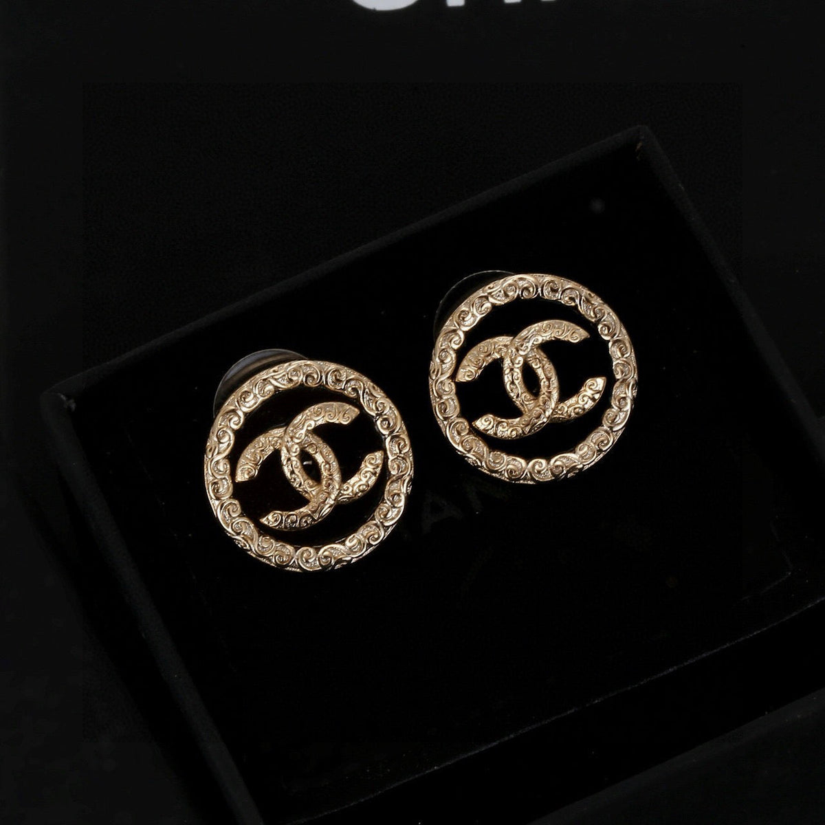 Martin Graham stud earrings in polished metal-tone – styled product view