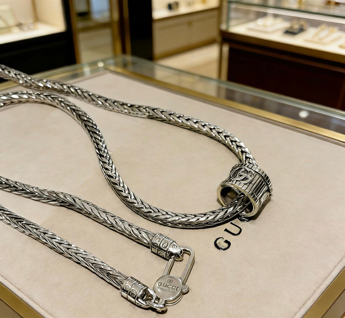 Martin Graham pendant necklace in polished metal-tone – detail view