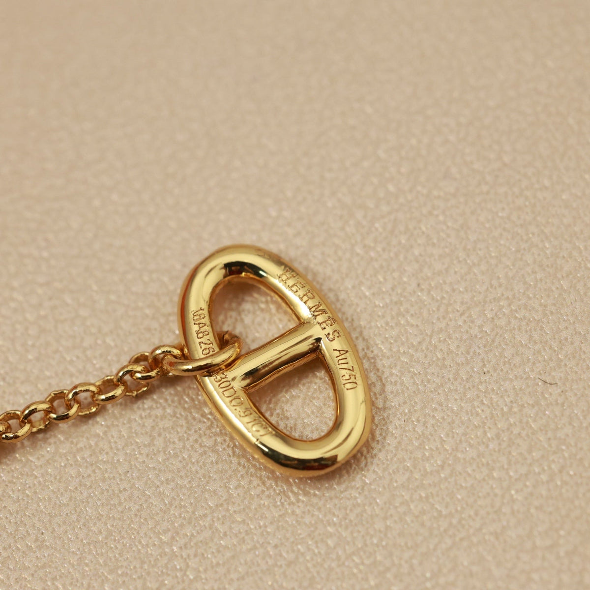 Martin Graham stud earrings in polished metal-tone – detail view