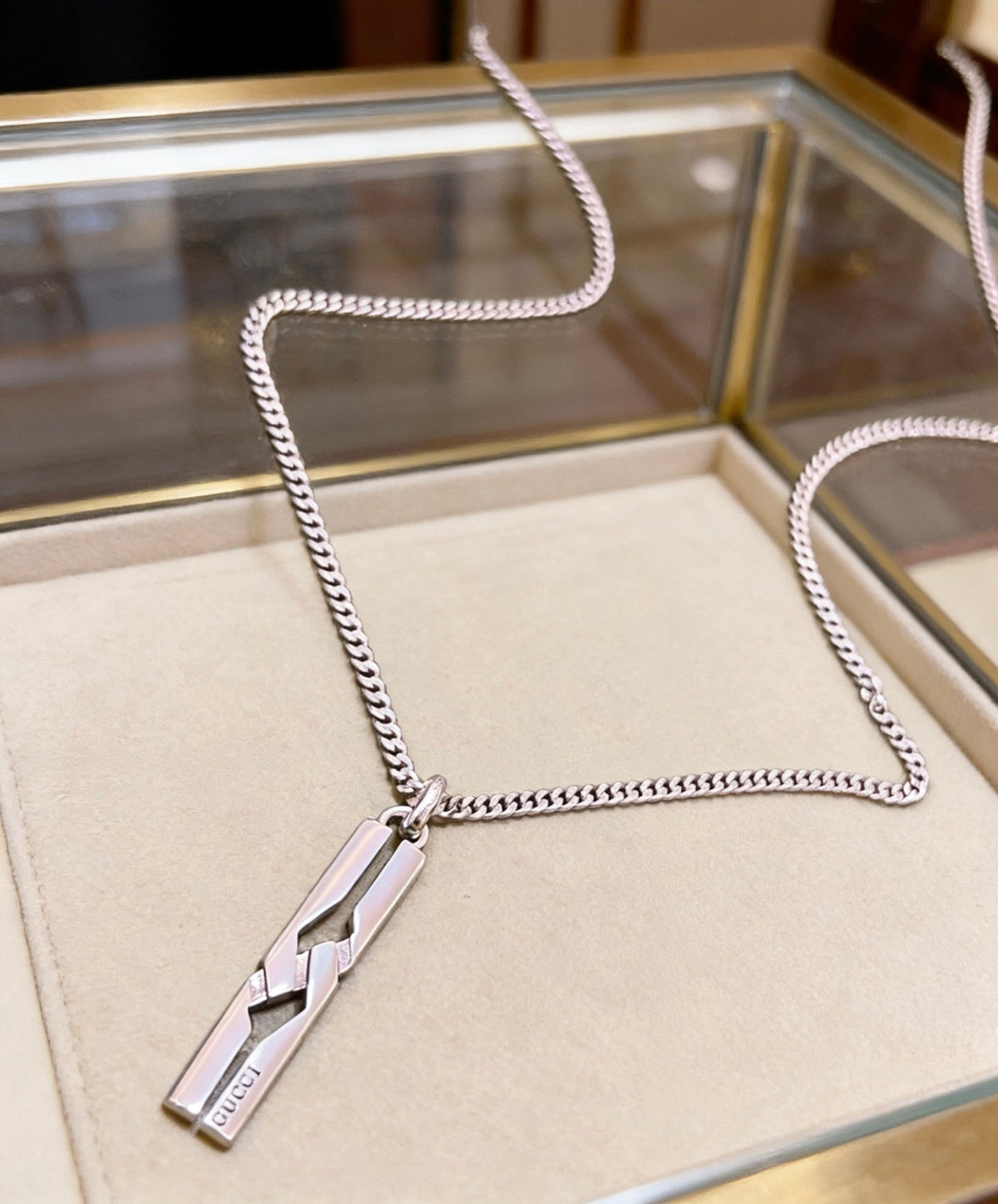 Martin Graham pendant necklace in polished metal-tone – detail view