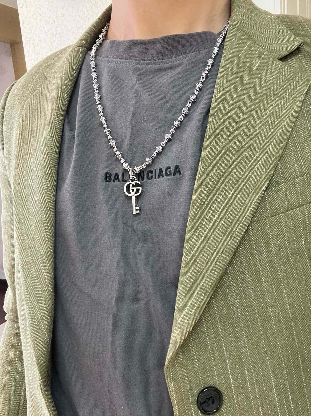 Martin Graham pendant necklace in polished metal-tone – detail view