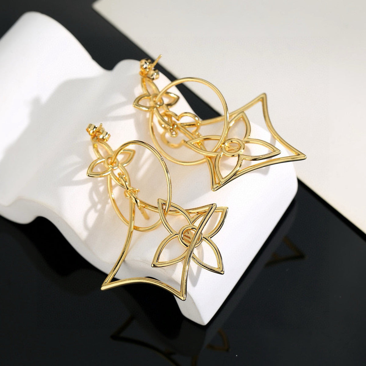 Martin Graham stud earrings in polished metal-tone – front product view