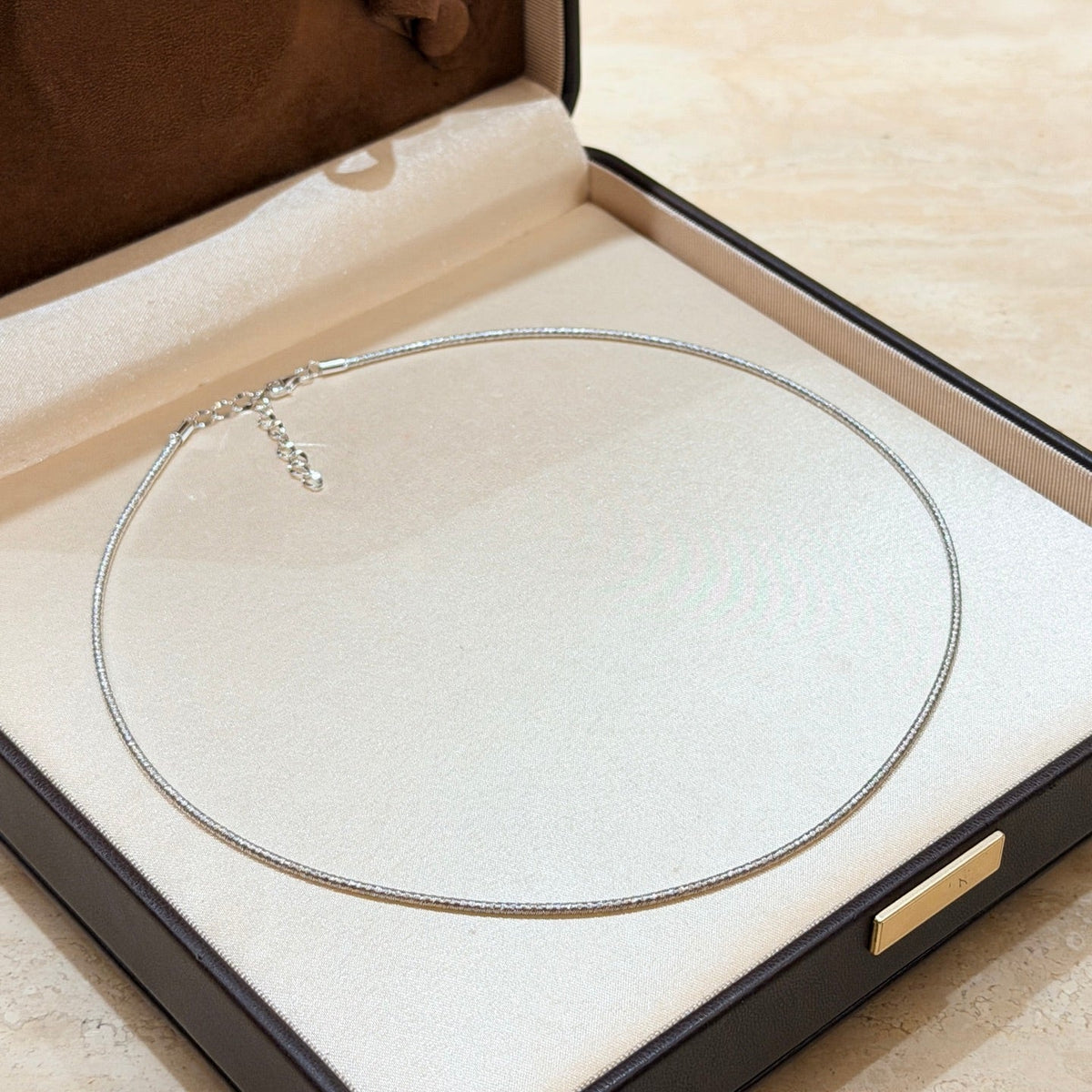 Martin Graham pendant necklace in polished metal-tone – detail view