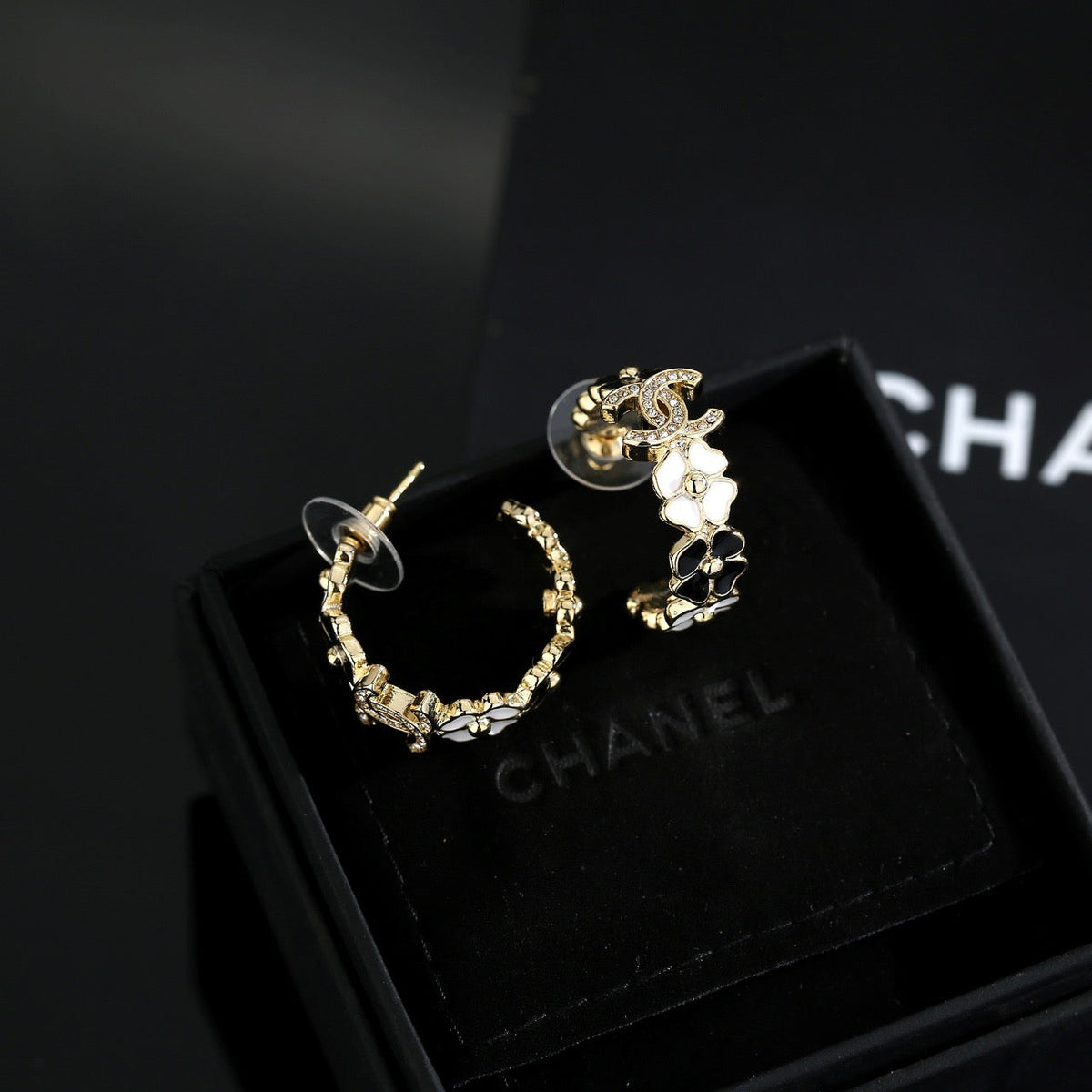 Martin Graham stud earrings in polished metal-tone – styled product view