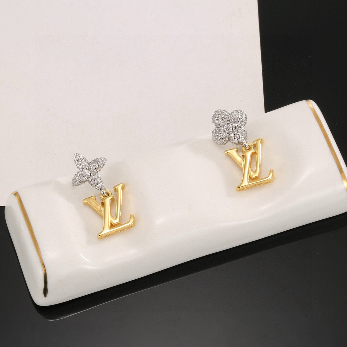 Martin Graham stud earrings in polished metal-tone – styled product view