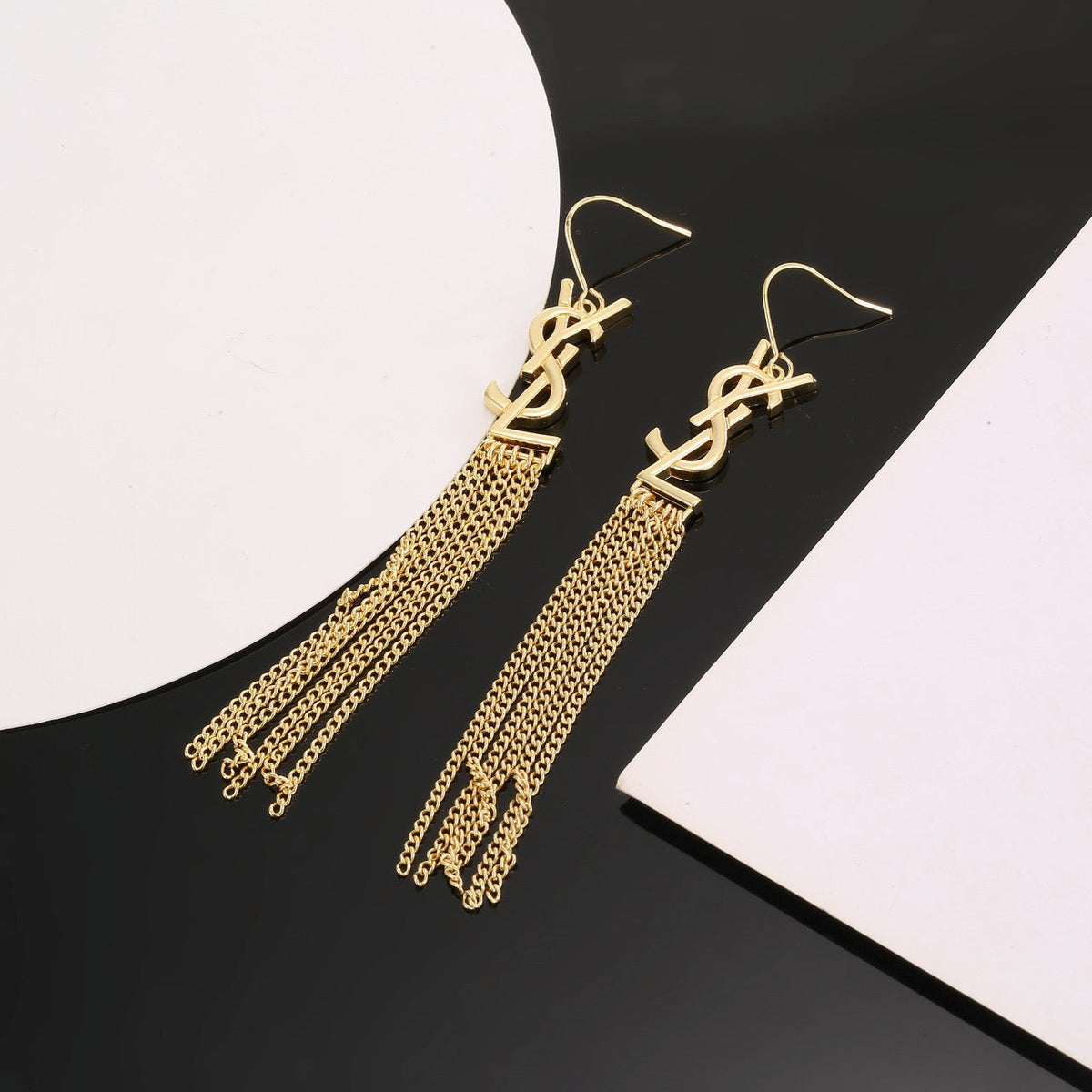 Martin Graham stud earrings in polished metal-tone – styled product view