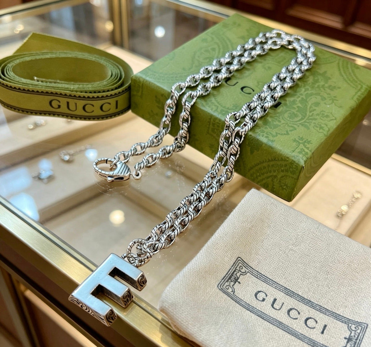 Martin Graham pendant necklace in polished metal-tone – detail view