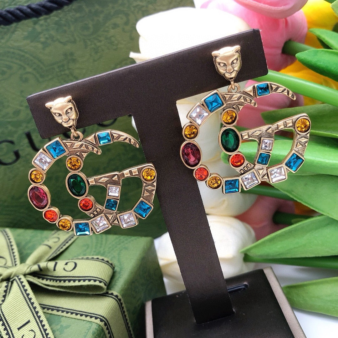 Martin Graham stud earrings in polished metal-tone – styled product view