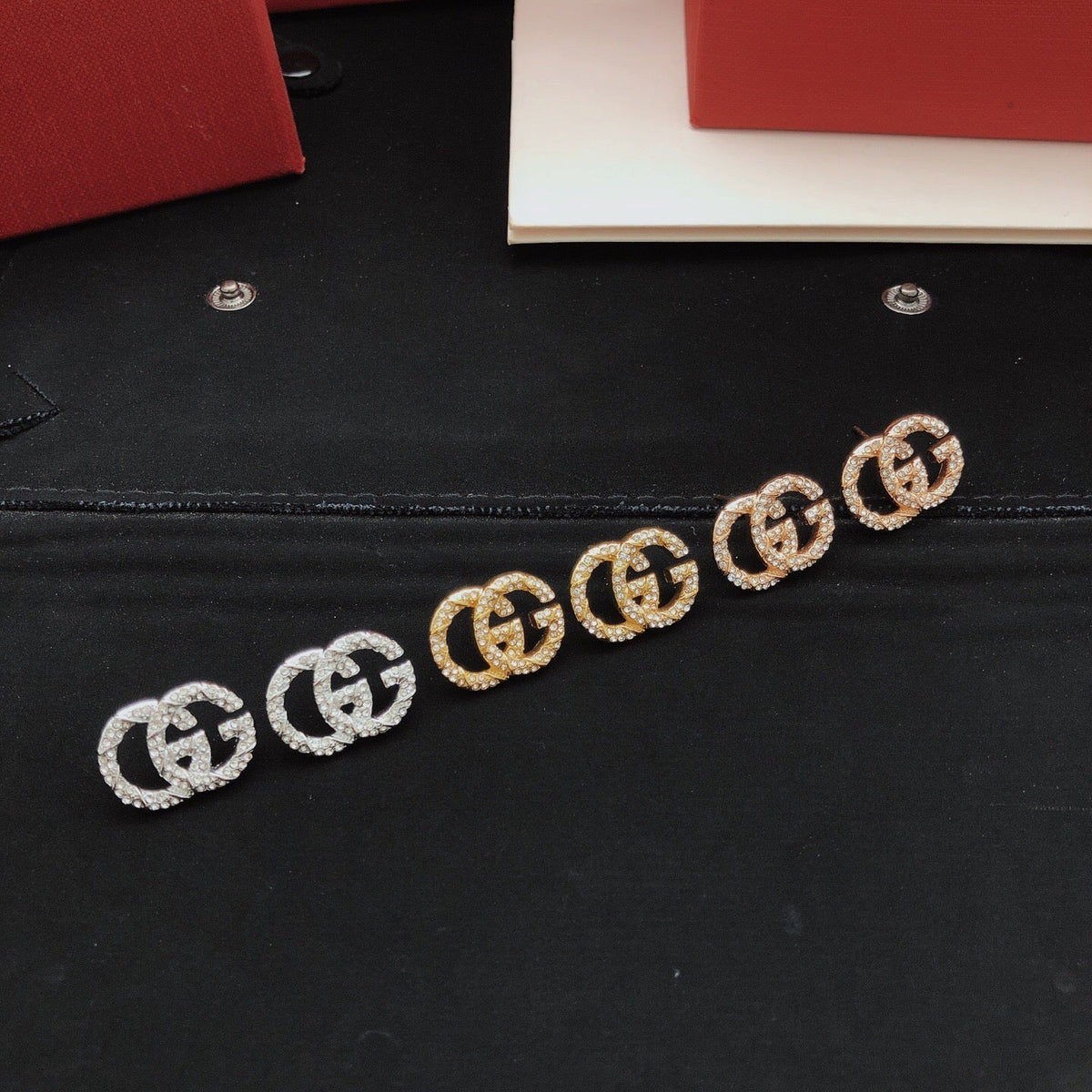 Martin Graham stud earrings in polished metal-tone – detail view