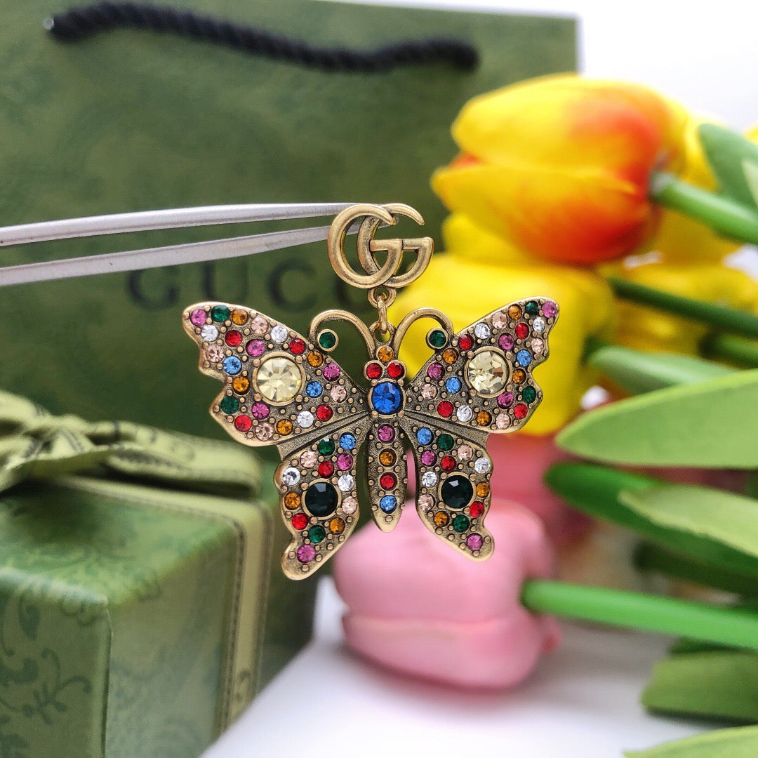 Martin Graham stud earrings in polished metal-tone – front product view