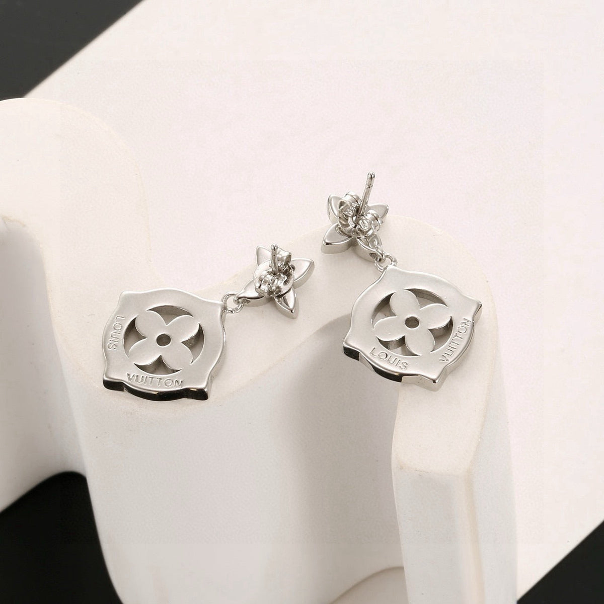 Martin Graham stud earrings in polished metal-tone – front product view