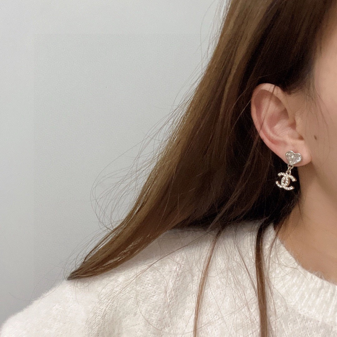 Martin Graham stud earrings in polished metal-tone – detail view