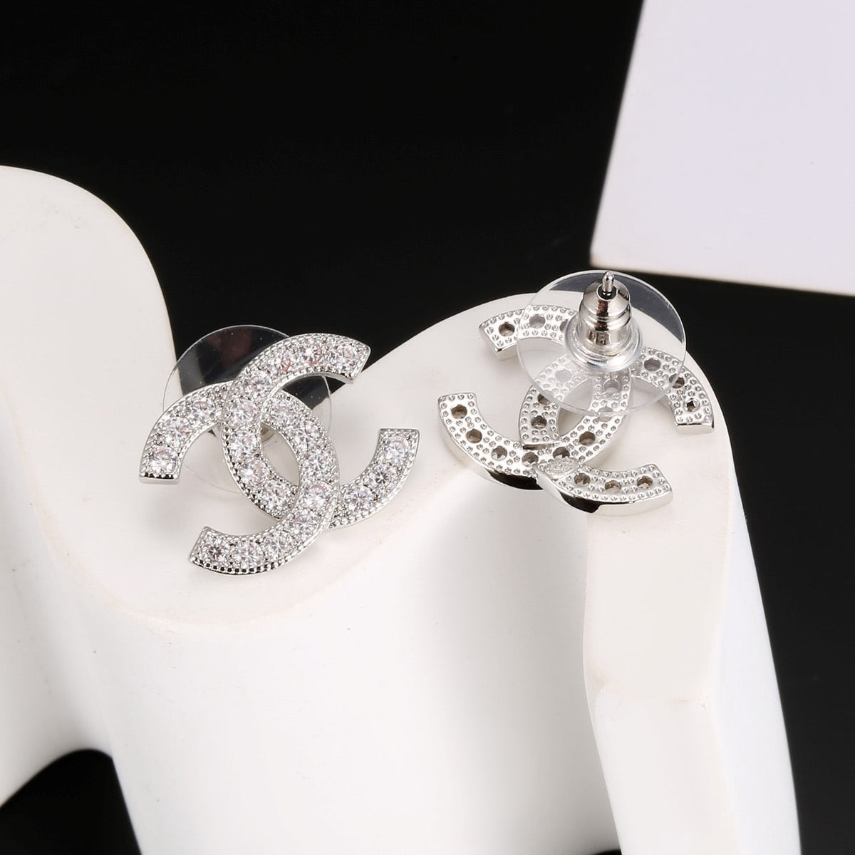 Martin Graham stud earrings in polished metal-tone – styled product view
