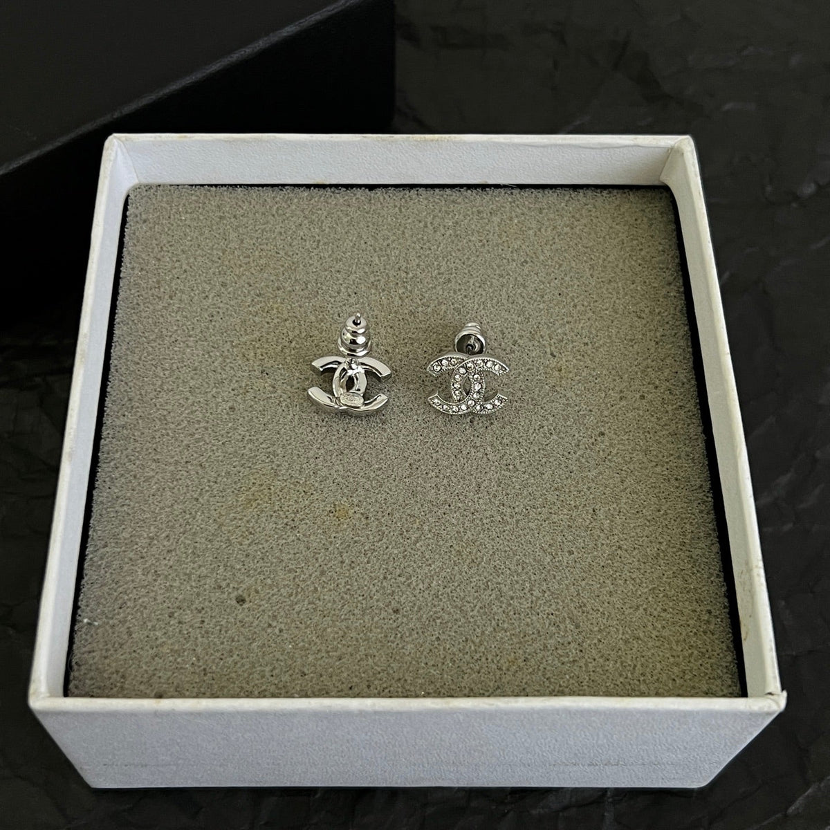 Martin Graham stud earrings in polished metal-tone – styled product view