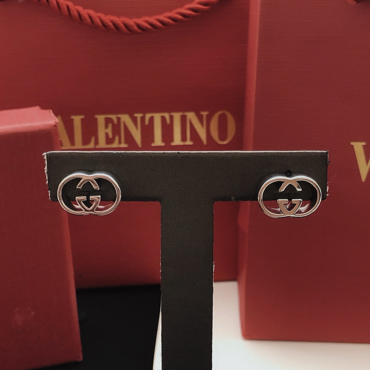 Martin Graham stud earrings in polished metal-tone – detail view