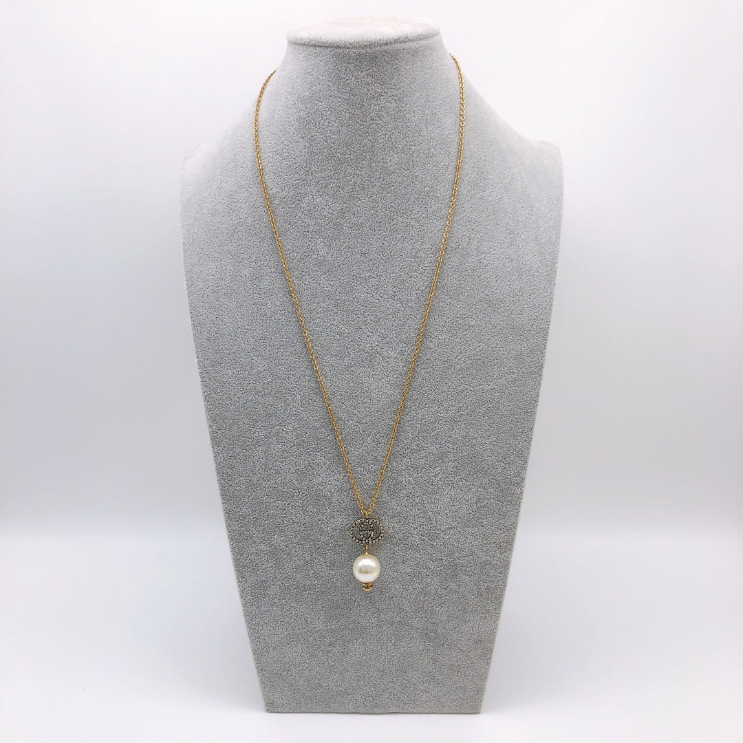 Martin Graham pendant necklace in polished metal-tone – close-up detail