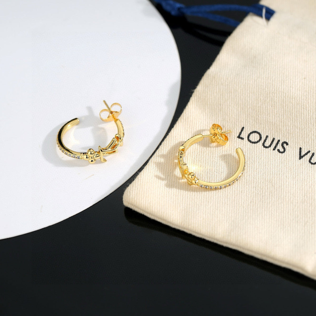 Martin Graham stud earrings in polished metal-tone – styled product view