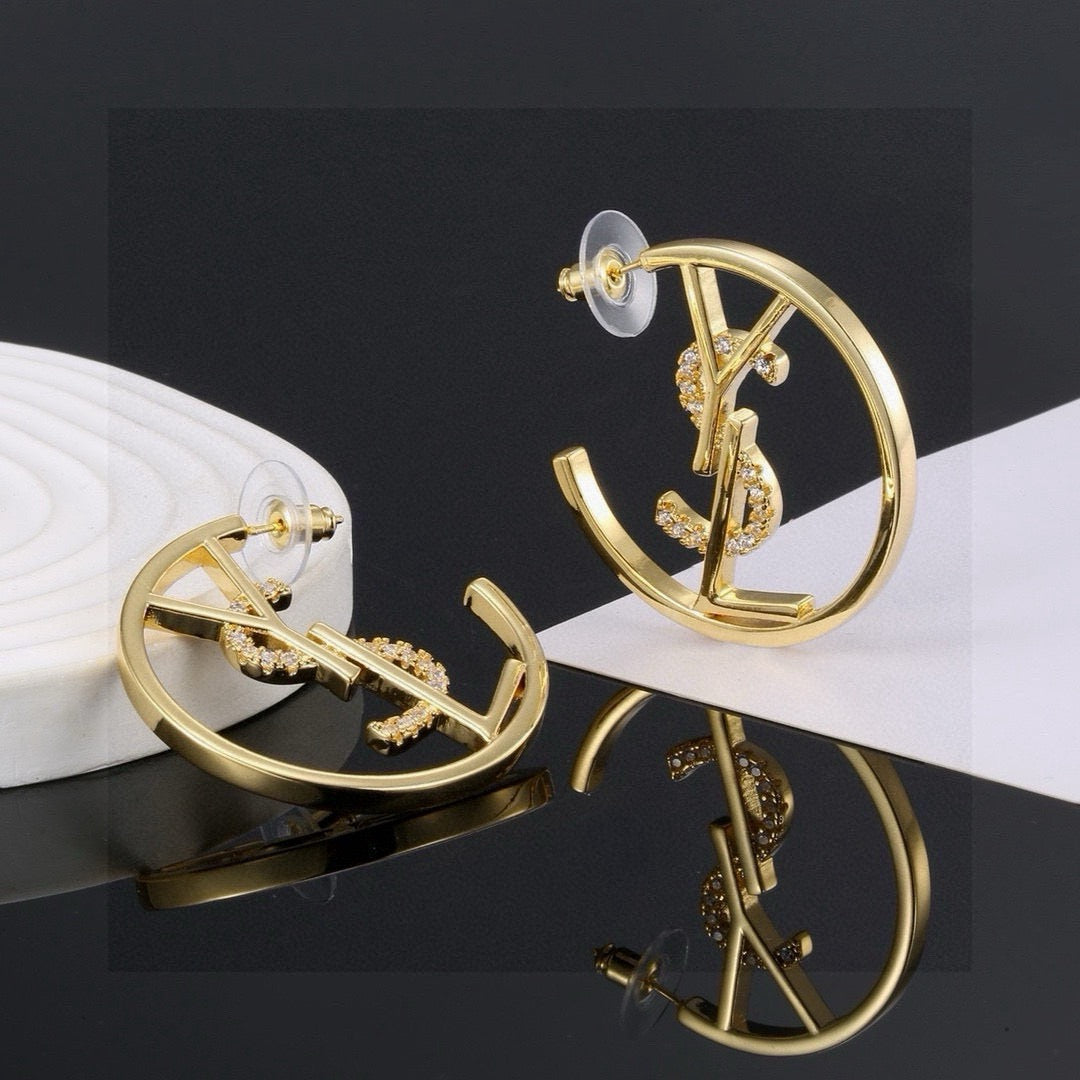 Martin Graham stud earrings in polished metal-tone – styled product view