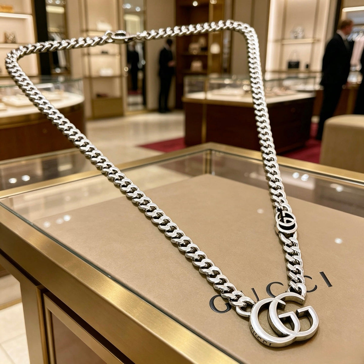 Martin Graham pendant necklace in polished metal-tone – detail view
