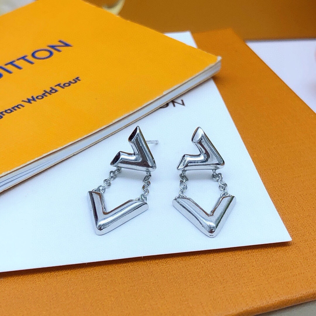 Martin Graham stud earrings in polished metal-tone – detail view