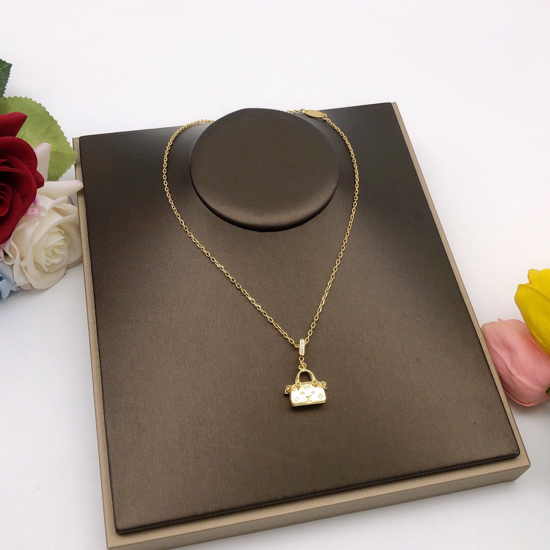 Martin Graham pendant necklace in polished metal-tone – detail view
