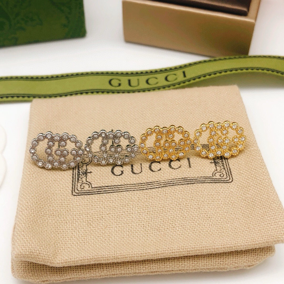 Martin Graham stud earrings in polished metal-tone – styled product view