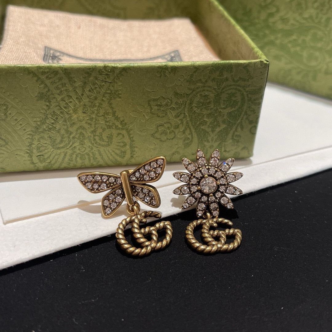 Martin Graham stud earrings in polished metal-tone – styled product view